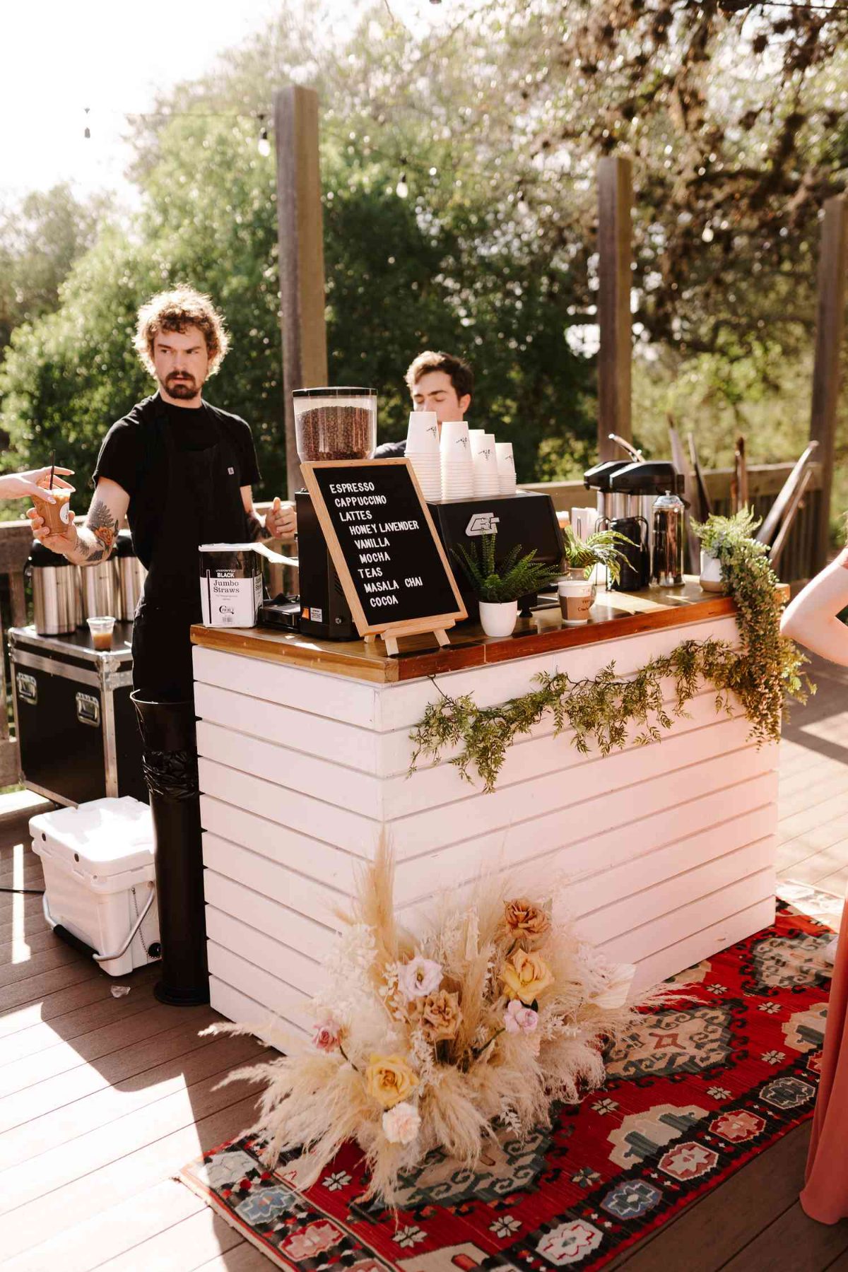 Wedding coffee bar with floral decor